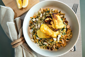 Kale and Carrot Fried Rice with Almonds, Sultanas, Haloumi, and Lemon.